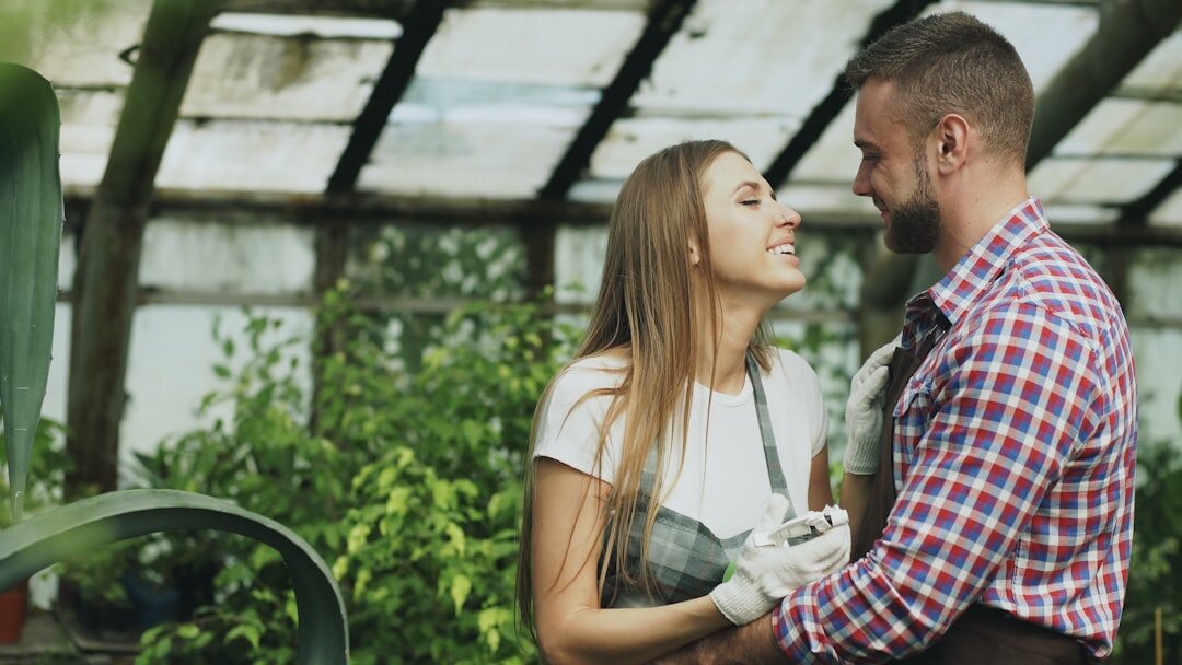 Lithuanian couple in their fifties working together in a vegetable garden